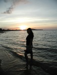 Amber silhouetted against a Meanam sunset