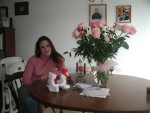 Amber sitting at the table with her roses