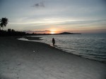 Amber walking along Maenam Beach during sunset