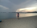 Amber walking along beach at bungalows