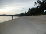 Amber walking along beach of Maenam