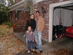 Amber, T, and Erik in front of house