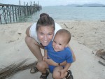 Amber smiling big with Erik at Big Buddha Pier beach