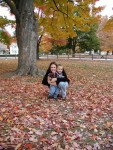 Mommy and Erik surrounded by fall leaves