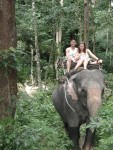 Teera and Amber going thru jungle on elephant